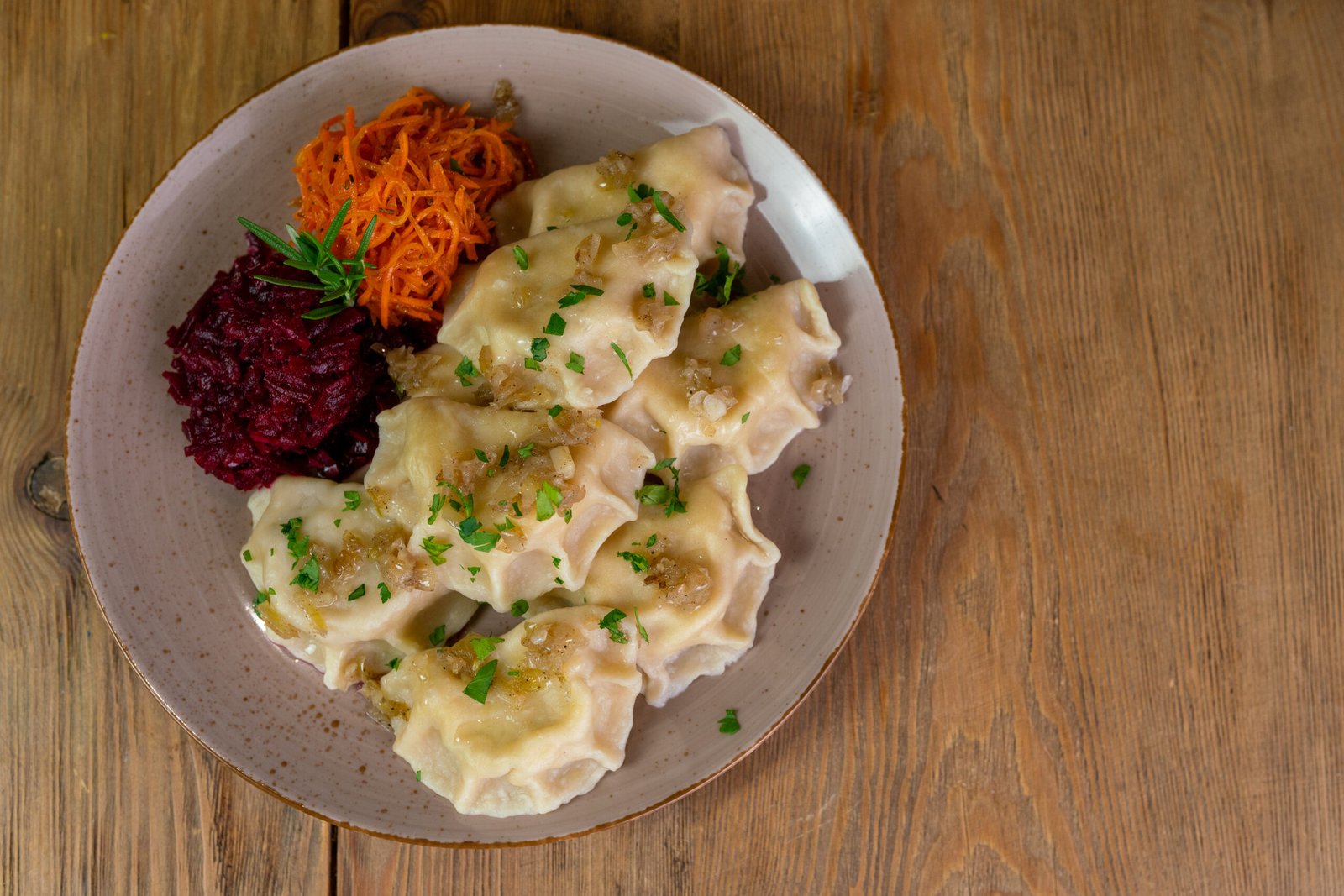 Dumplings with onion lard and salads